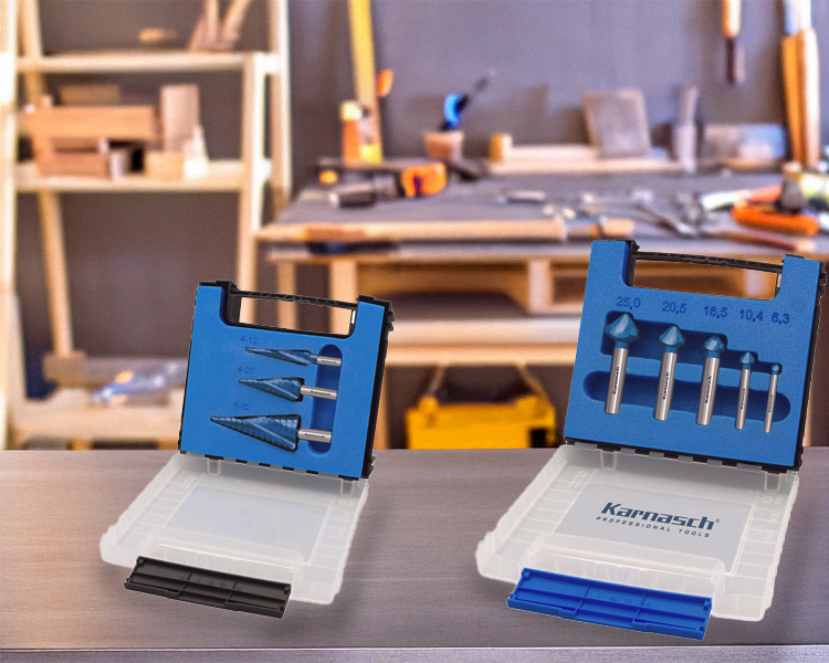 Karnasch drill bits and step bits organized on a workbench, highlighting the quality of Karnasch tools for industrial use