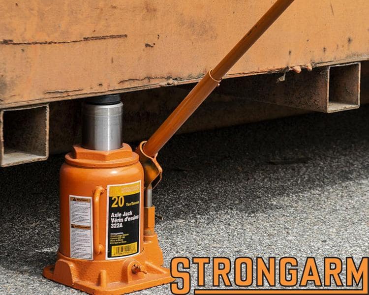 Strongarm solid jacks used for safely holding up heavy loads and machinery in industrial environments.